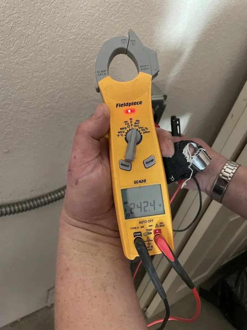 Voltage testing with clamp meter during Generator Installation in Farmers Branch
